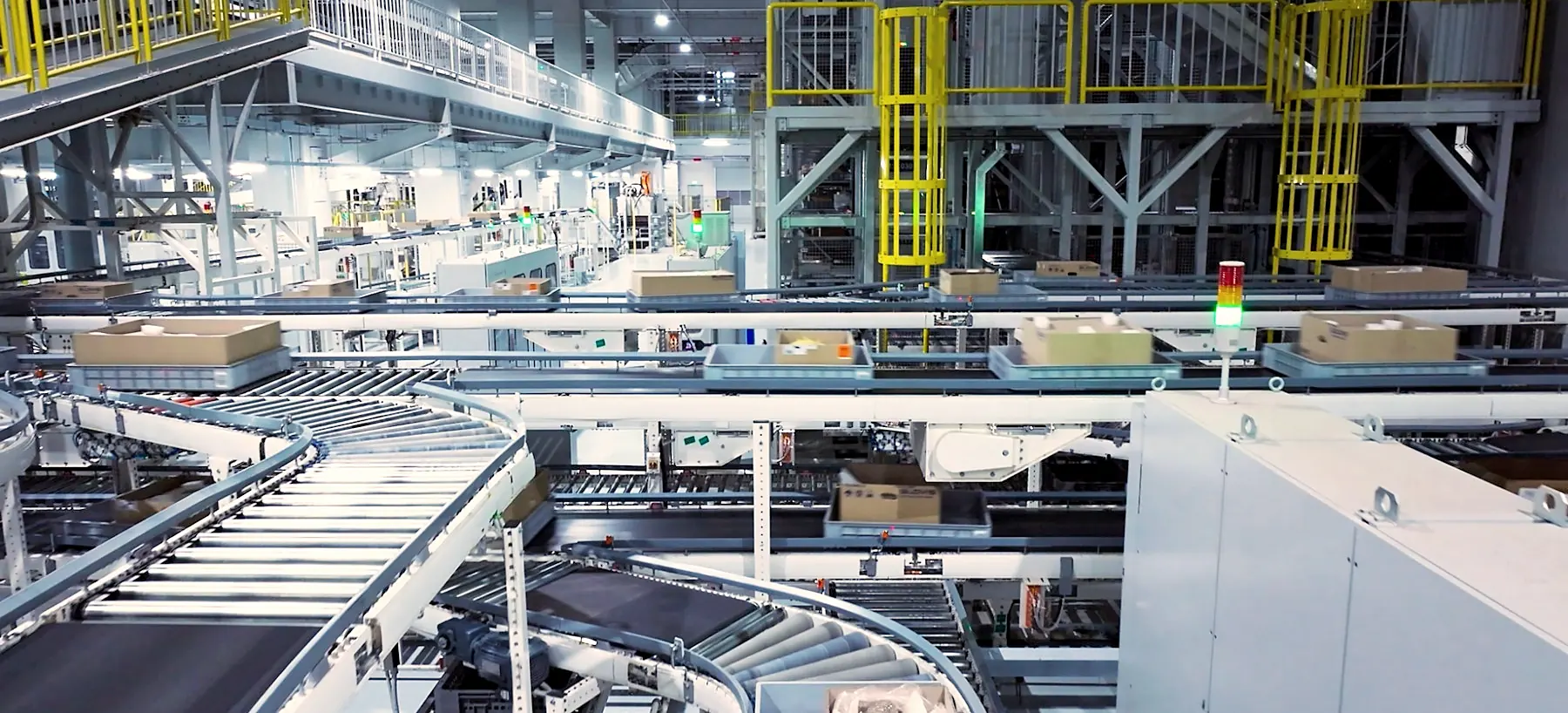 Cartons moving through an automated sortation conveyor