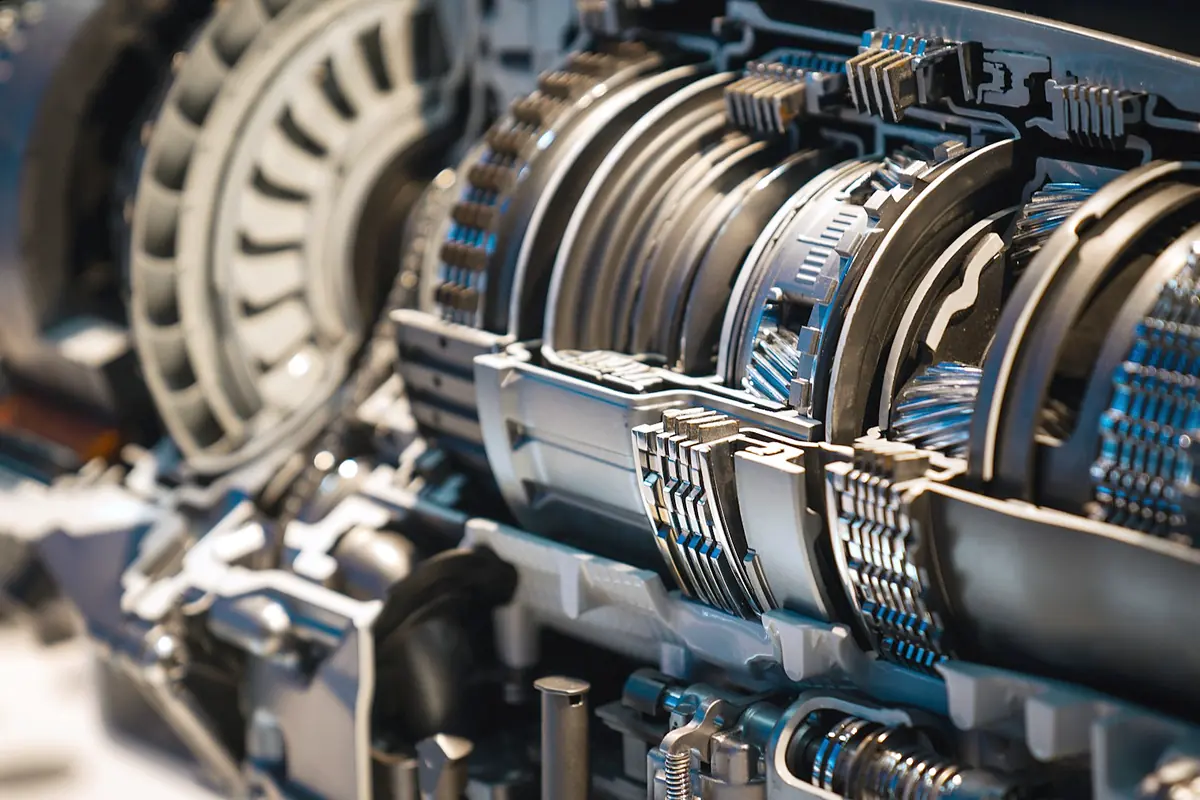 A sectioned automatic transmission showing clutch packs, gear sets and the torque converter