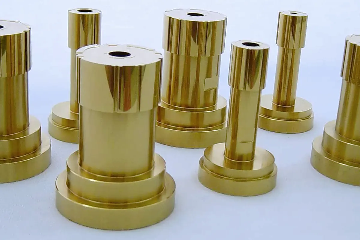 Ground steel punches finished in a bright gold titanium nitride coating